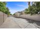 Expansive concrete backyard featuring high block walls, offering privacy and ample space at 7460 Grassy Field Ct, Las Vegas, NV 89131