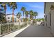 Large balcony with ornate white railing overlooks lush landscaping and surrounding neighborhood at 7460 Grassy Field Ct, Las Vegas, NV 89131