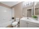 Bathroom featuring a single sink vanity, white toilet, and shower-tub combination at 7460 Grassy Field Ct, Las Vegas, NV 89131