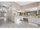 Bathroom with dual sinks, tile flooring, and lots of counter space for toiletries and decorations at 7460 Grassy Field Ct, Las Vegas, NV 89131