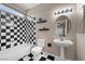 Bathroom featuring a bathtub, shower, vanity, toilet and black and white accents at 7460 Grassy Field Ct, Las Vegas, NV 89131