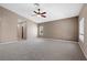 Bright bedroom with a ceiling fan, and plush carpeting at 7460 Grassy Field Ct, Las Vegas, NV 89131