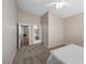 This is a bedroom with neutral walls and carpet featuring multiple entryways at 7460 Grassy Field Ct, Las Vegas, NV 89131
