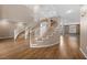 Elegant foyer showcasing a winding staircase with light wood floors and chandelier at 7460 Grassy Field Ct, Las Vegas, NV 89131