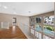 Open hallway overlooking a sparkling pool and backyard oasis, offering a bright and airy feel at 7460 Grassy Field Ct, Las Vegas, NV 89131