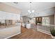 Bright kitchen with granite countertops, stainless steel appliances and an open connection to the living room at 7460 Grassy Field Ct, Las Vegas, NV 89131