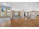Sunlit living room boasting a combination of carpet and hardwood floors at 7460 Grassy Field Ct, Las Vegas, NV 89131