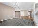 Open-concept room showcasing neutral tones and a decorative chandelier at 7460 Grassy Field Ct, Las Vegas, NV 89131