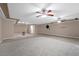 Recreation room with ceiling fans, tile floors and carpet at 7460 Grassy Field Ct, Las Vegas, NV 89131