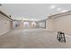 Recreation room featuring a projector screen, tile flooring, and carpet at 7460 Grassy Field Ct, Las Vegas, NV 89131