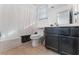A bathroom features a shower-tub combination with a white shower curtain and a dark wood vanity at 7912 Painted Rock Ln, Las Vegas, NV 89149
