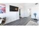 A bright room with gray wood flooring and natural light offers a comfortable workspace at 7912 Painted Rock Ln, Las Vegas, NV 89149