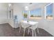 Bright dining area features large windows, tile flooring, and contemporary decor at 7912 Painted Rock Ln, Las Vegas, NV 89149