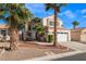 Home featuring desert landscaping, a two-car garage, and well manicured trees at 7912 Painted Rock Ln, Las Vegas, NV 89149