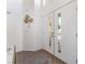 Inviting foyer featuring tiled flooring, bright lighting, and closet at 7912 Painted Rock Ln, Las Vegas, NV 89149
