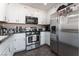 Functional kitchen featuring stainless steel appliances and white cabinetry at 7912 Painted Rock Ln, Las Vegas, NV 89149