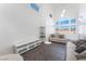 Bright living room featuring modern lighting, couches, and neutral decor at 7912 Painted Rock Ln, Las Vegas, NV 89149