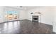 Bright living room with tiled floors, fireplace, and sliding glass doors leading to the backyard at 7912 Painted Rock Ln, Las Vegas, NV 89149