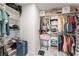 A walk-in closet has shelving, hanging clothes, and space for storage at 7912 Painted Rock Ln, Las Vegas, NV 89149