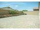 Large brick patio with block wall and mature landscaping at 8223 Buffalo Ranch Ave, Las Vegas, NV 89147