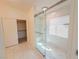 Bathroom featuring a walk-in closet and a glass-enclosed shower with a bench at 8223 Buffalo Ranch Ave, Las Vegas, NV 89147
