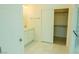Bathroom showcasing a vanity with marble countertop, and a walk-in closet, offering comfort and style at 8223 Buffalo Ranch Ave, Las Vegas, NV 89147