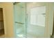 Bathroom showcasing a glass-enclosed shower with marble tiling and a built-in bench at 8223 Buffalo Ranch Ave, Las Vegas, NV 89147