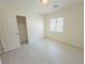 Standard bedroom with closet, window, and light wood floors at 8223 Buffalo Ranch Ave, Las Vegas, NV 89147