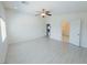 Bright bedroom featuring light walls, wood-look floors, and multiple entryways at 8223 Buffalo Ranch Ave, Las Vegas, NV 89147
