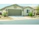 Inviting single-story home with a two-car garage and low maintenance desert landscaping at 8223 Buffalo Ranch Ave, Las Vegas, NV 89147