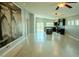 Open-concept living room with wood floors that flows into the modern kitchen at 8223 Buffalo Ranch Ave, Las Vegas, NV 89147
