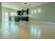 Spacious living room with hardwood floors, modern kitchen, and ample natural light at 8223 Buffalo Ranch Ave, Las Vegas, NV 89147