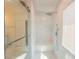 Modern shower with glass door, marble tile, and a built-in shower bench at 8223 Buffalo Ranch Ave, Las Vegas, NV 89147
