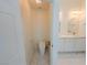 Clean toilet room with modern toilet, white walls and floors and lighting at 8223 Buffalo Ranch Ave, Las Vegas, NV 89147