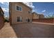 The backyard of the house has a large, empty lot with fencing at 8276 Sorrel St, Las Vegas, NV 89139
