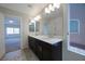 Bathroom boasts double sinks, granite counters, and natural light at 8276 Sorrel St, Las Vegas, NV 89139