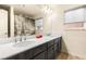 Elegant bathroom with a double sink vanity, stylish mirrors, and modern lighting fixtures at 8276 Sorrel St, Las Vegas, NV 89139