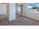 Cozy bedroom has a window, mirrored closet, and neutral color scheme at 8276 Sorrel St, Las Vegas, NV 89139