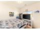 Cozy bedroom featuring sports decorations and a modern TV stand for a stylish retreat at 8276 Sorrel St, Las Vegas, NV 89139