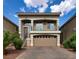 Beautiful two-story home showcasing a front-facing balcony, complemented by a brick driveway and desert landscaping at 8276 Sorrel St, Las Vegas, NV 89139