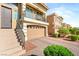 Home featuring a two-car garage, and beautiful landscaping at 8276 Sorrel St, Las Vegas, NV 89139