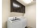 Efficient laundry room equipped with modern washer and dryer and ample storage space at 8276 Sorrel St, Las Vegas, NV 89139