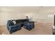 Spacious living room with a comfortable sectional sofa and an inviting atmosphere at 8276 Sorrel St, Las Vegas, NV 89139