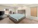 Comfortable main bedroom with large windows, carpeted floor, and a sitting area at 8276 Sorrel St, Las Vegas, NV 89139