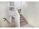 Carpeted staircase with white banister offers secure access to upper levels at 8276 Sorrel St, Las Vegas, NV 89139