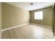 Bedroom showing neutral paint, window, and new flooring at 8410 Eldora Ave # 1003, Las Vegas, NV 89117