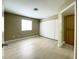 Bedroom featuring closet with sliding doors, new flooring, and neutral paint at 8410 Eldora Ave # 1003, Las Vegas, NV 89117