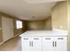 Open-concept kitchen with modern countertop bar open to the living space at 8410 Eldora Ave # 1003, Las Vegas, NV 89117