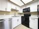 Contemporary kitchen with white cabinets, stainless steel appliances, and ample counter space at 8410 Eldora Ave # 1003, Las Vegas, NV 89117
