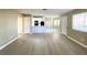 Open-concept living area showcasing the new floors, and connection to the kitchen at 8410 Eldora Ave # 1003, Las Vegas, NV 89117